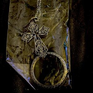 Magnifying cross necklace